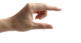 hands as if holding something between thumb